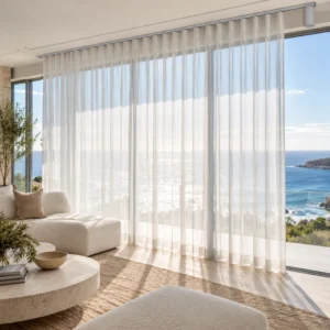 - White sheer curtains filtering sunlight through waterfront living-room windows.