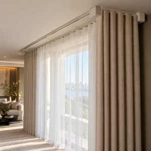 White sheer curtains and beige blackout curtains fitted on parallel ceiling tracks.