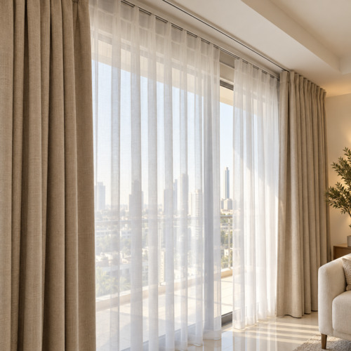 Beige blackout curtains and white sheers on a dual track in JVC